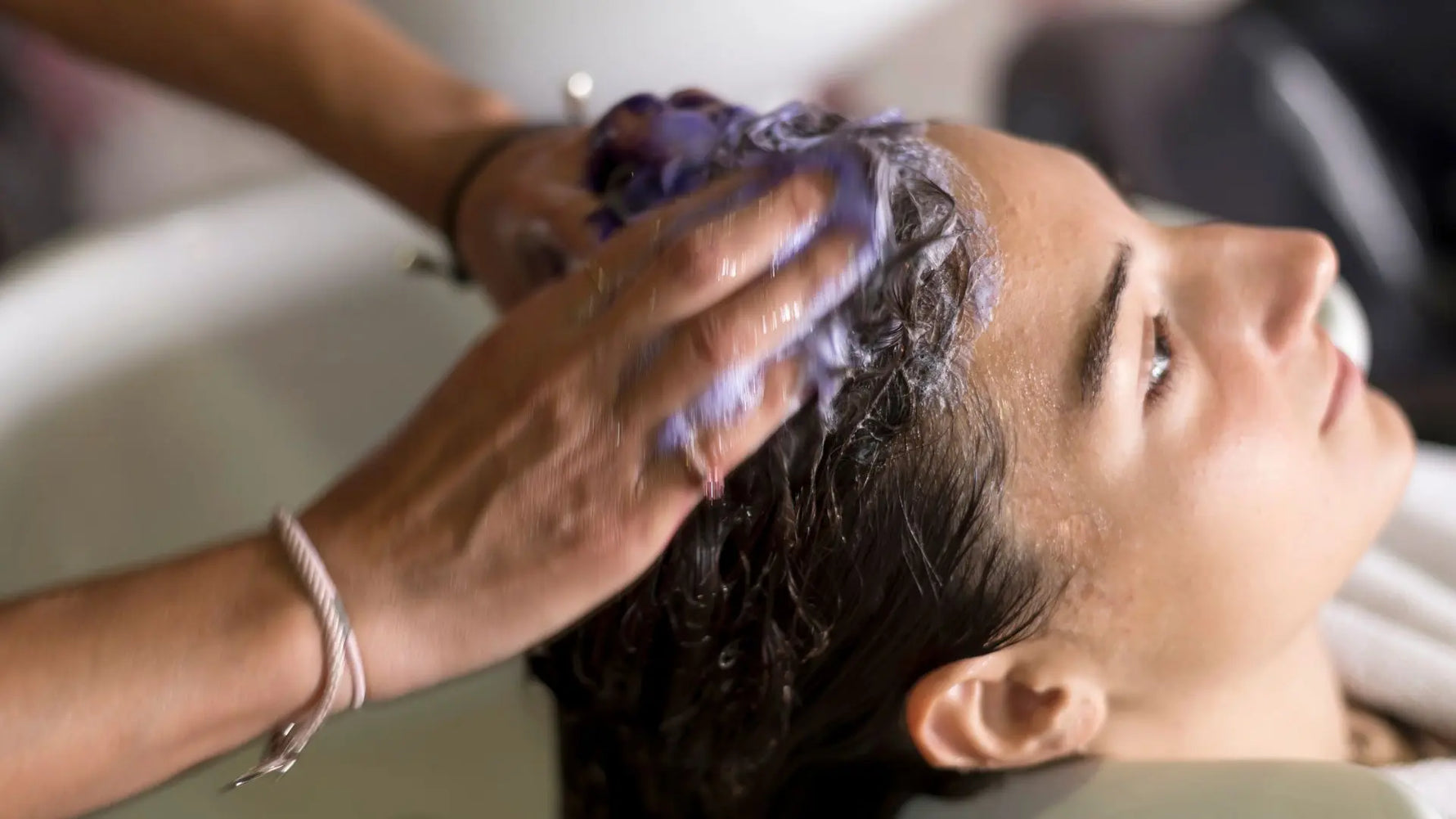 A girl getting massage for the Hair Care